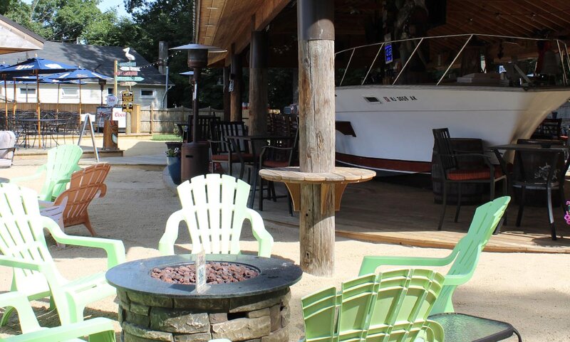 The Boat Yard with firepit and boat bar in background