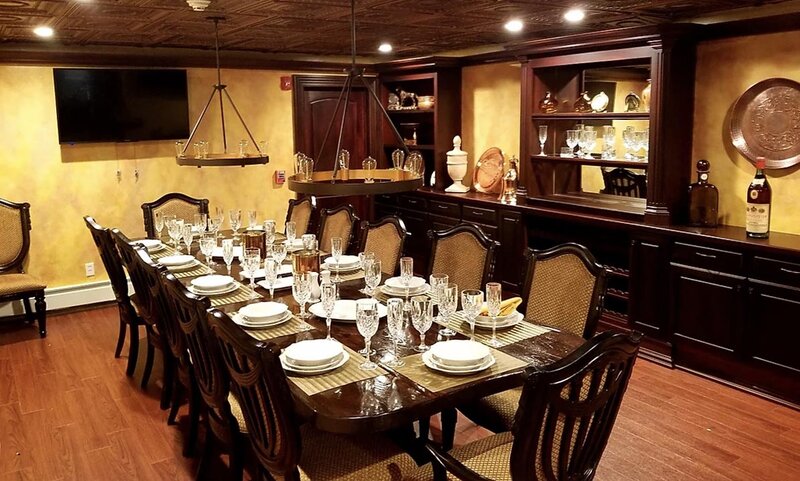 Tuscany Room dining room table with set table and seating for twelve
